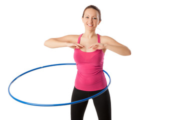 Fototapeta na wymiar fitness woman working with hula hoop smiling isolated over white