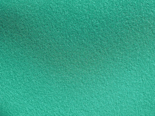 Green artificial synthetic grass meadow background