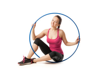 Beautiful woman sitting with color hula hoop © julenochek