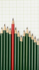 Pencils arrangement in pattern of graph on graph sheet.