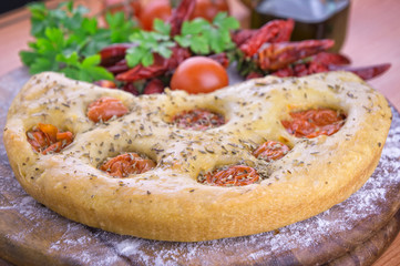 Traditional italian focaccia with cherry tomatoes
