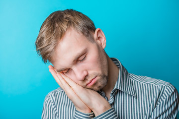 handsome student tired after studying lessons