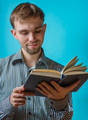 Portrait of young man reading