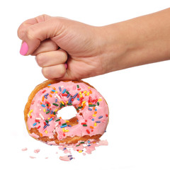 Woman Hand Smashing Donut with Sprinkles isolated