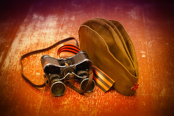 garrison cap with a red star, military binoculars, George Ribbon
