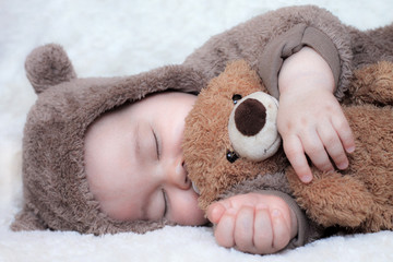 Sleeping baby with toy