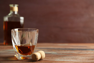 Whiskey on wooden background