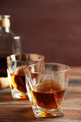 Whiskey on wooden background
