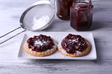 Delicious cookies with jam and powdered sugar