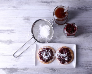 Delicious cookies with jam and powdered sugar
