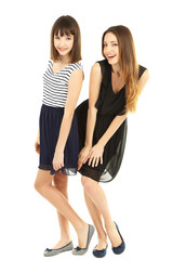 Two beautiful girls isolated on white