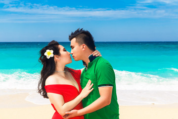 Fototapeta na wymiar Asian couple on a tropical beach. Wedding and honeymoon concept.