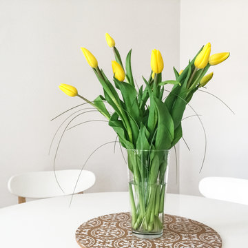 Bouquet Of Yellow Tulips On A Table