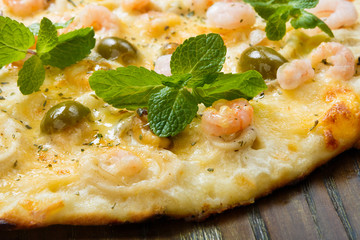 Delicious seafood pizza with olives