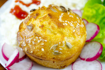 Corn bread with sesame and radish on a plate