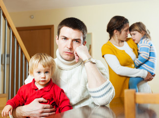 Family with two children having quarrel at home