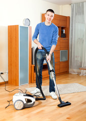 Ordinary guy  vacuuming