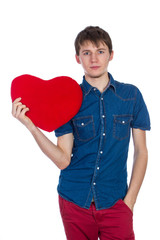 Handsome man holding a red heart  on white background