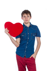 Handsome man holding a red heart on white background