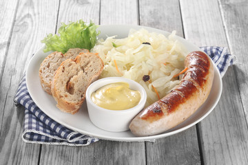 Veggies and Sausage on Plate with Bread and Sauce