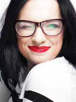 young emotional  brunette woman wearing glasses