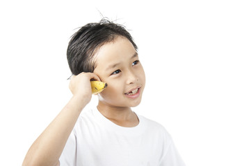 Boy use banana like phone