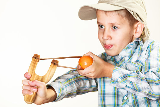 Kid Holding Slingshot In Hands