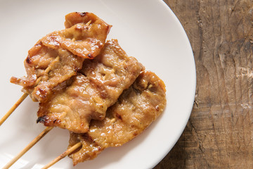 Grilled pork and sticky rice on plate, Thai food style