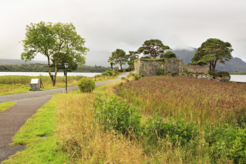 Fototapeta na wymiar Ruins of an ancient fortress on Lough Leane Lower Lake.
