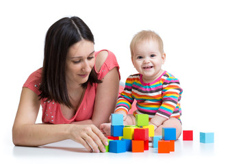 mother and baby play with building blocks toy isolated on white