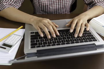 Fototapeta na wymiar Image of woman using a laptop