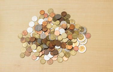 pile thai baht coin on plywood background