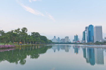 Fototapeta premium Scenery of a park and Bangkok cityscape view in the evening