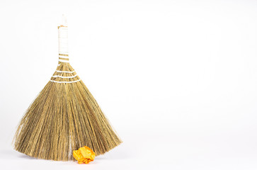 isolated besom and color paper ball