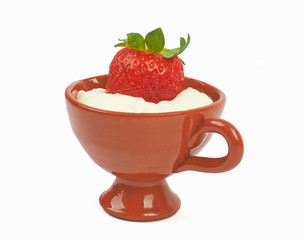 Yogurt with strawberries on a wooden table