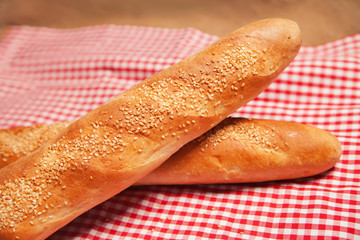 French bread isolated on checkered napkin
