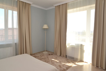 Fragment of an interior of a hotel room in light tones with two