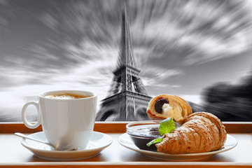 Coffee with croissants against Eiffel Tower in Paris, France