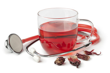 Cup of hibiscus tea and stethoscope