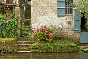 Fototapeta na wymiar Steps leading down to a river or canal