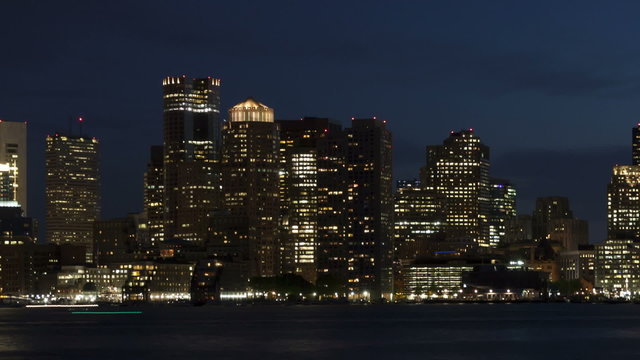 Time lapse close up pan shot slow Boston skyline at twilight