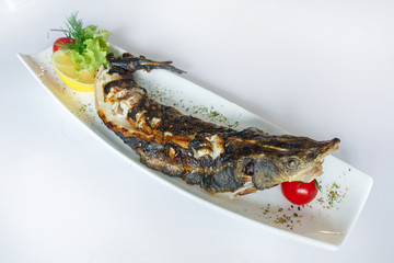 Pike fish cooked on the grill