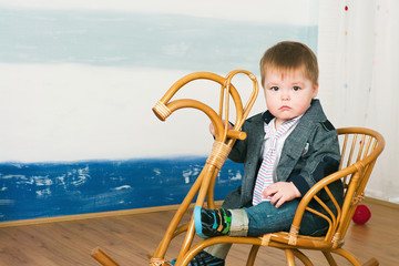 little boy on a horse rocking chair