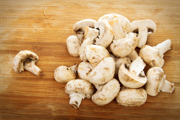 Champignon on wooden background