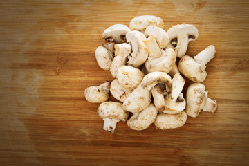 Champignon on wooden background