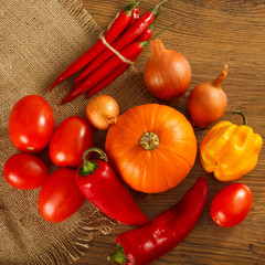 Fresh autumn vegetables lie on sacking