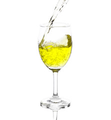 yellow water in wine glass. isolated on a white background