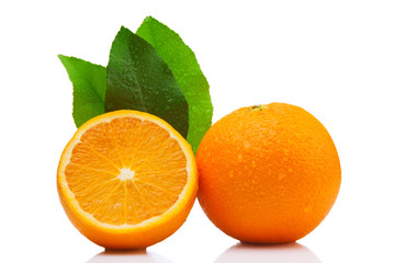 Whole and half orange, with leaves