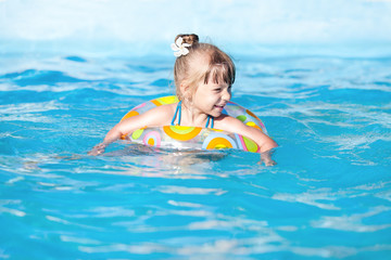 Happy Little Girl In The Pool