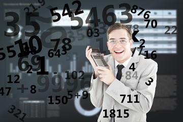 Composite image of geeky smiling businessman holding calculator